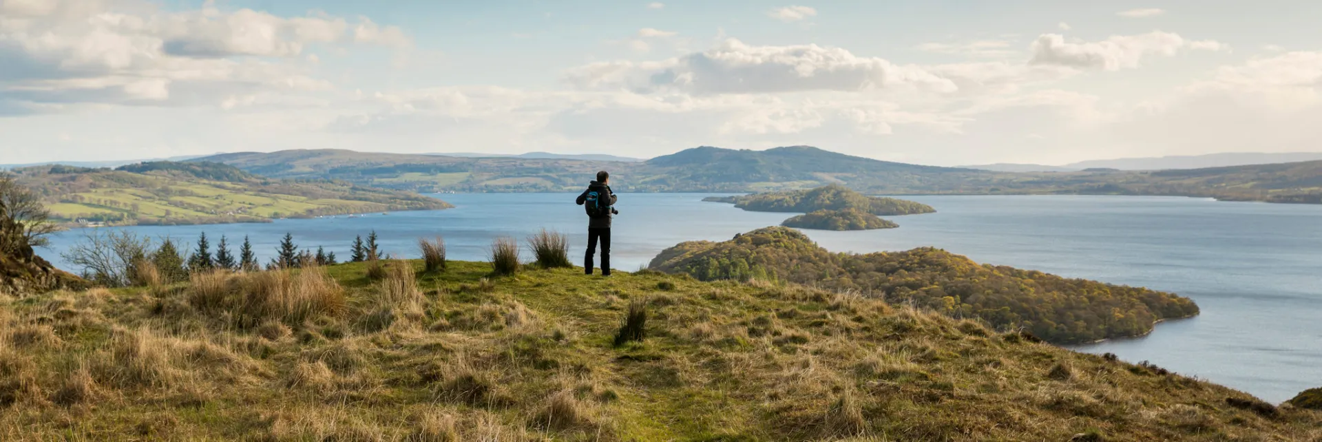 Walker on Conic Hill overlooking Loch Lomond - part of the West Highland Way © VisitScotland / Kenny Lam